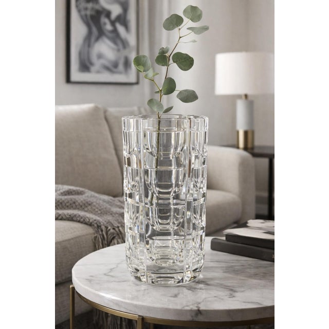 A striking vintage crystal vase by Orrefors, showcasing the iconic “Thousand Windows” pattern—an architectural composition...