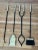 Striking mid-century modern fireplace tool set attributed to George Nelson. This four-piece set includes a poker, shovel,...