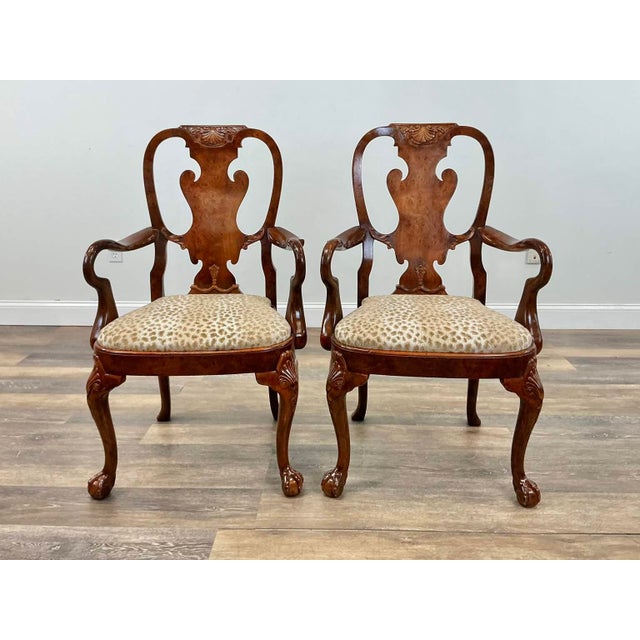 Traditional carved detailing meets an expressive animal-print accent in this matching set of eight Queen Anne–style dining...