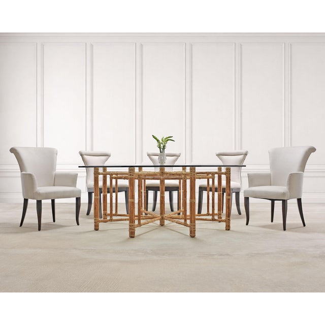 A large elegant set of ten Ralph Lauren-style dining chairs comprised of eight side chairs and two host armchairs. The...