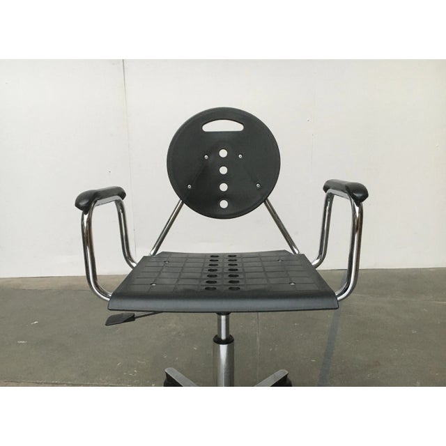 A design that is strongly influenced by a postmodern language of form and materiality. Surfaces of black plastic are...