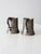 A charming pair of antique pewter tankards showcasing classic early 20th-century craftsmanship. Each features a subtly...