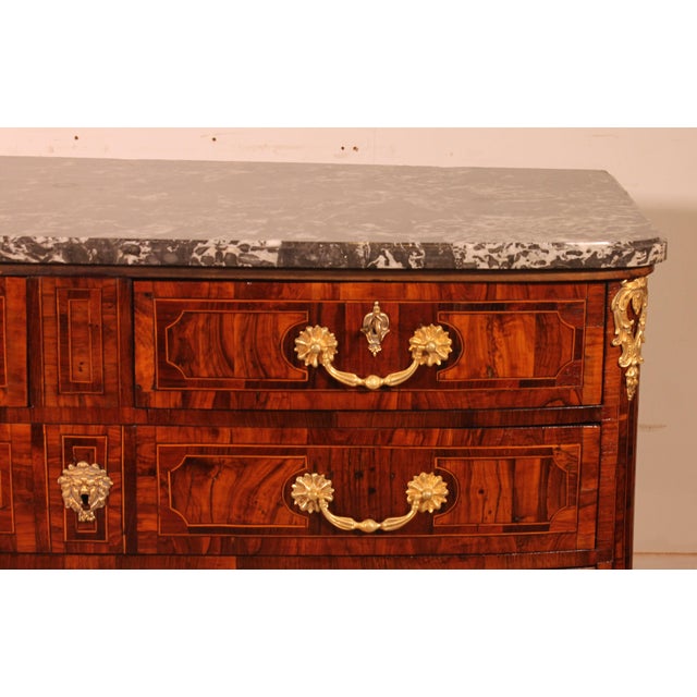 A very beautiful Louis XIV commode from the early 18th century, slightly curved at the front and flat at the sides,...