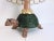 Darling whimsical wicker turtle lamp from the 1960s with blush pink head and legs, green scalloped shell, pink glass neck,...