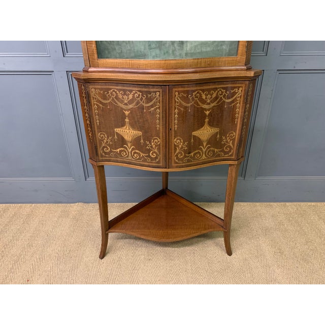 A fine quality Edwardian period inlaid mahogany corner cabinet , most probably made by Edwards & Roberts of London. Tall...