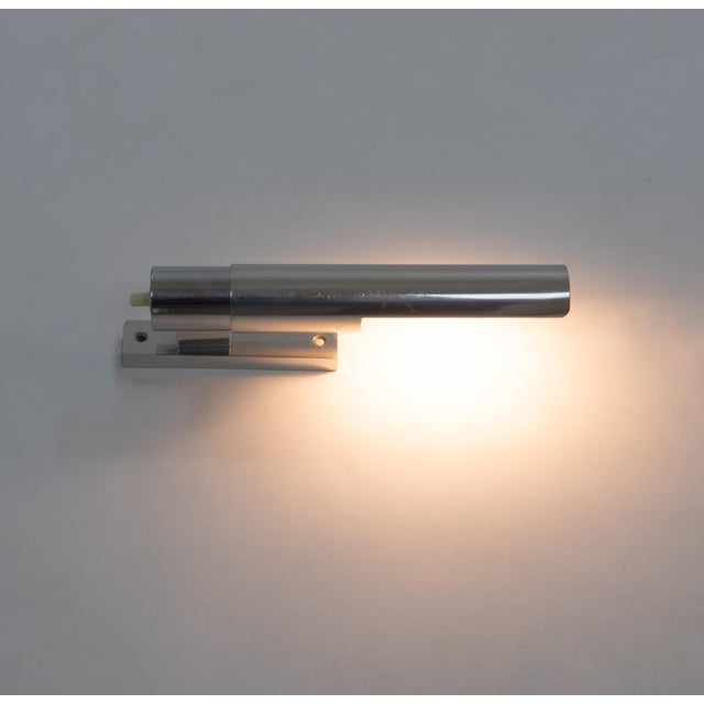 Wall lamp Model 211 designed by Gino Sarfatti in 1955 and manufactured by Arteluce. Model 211 consists of an aluminum base...