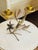 A charming vintage toleware candleholder designed as a cluster of hand-crafted flowers and foliage. Featuring two candle...