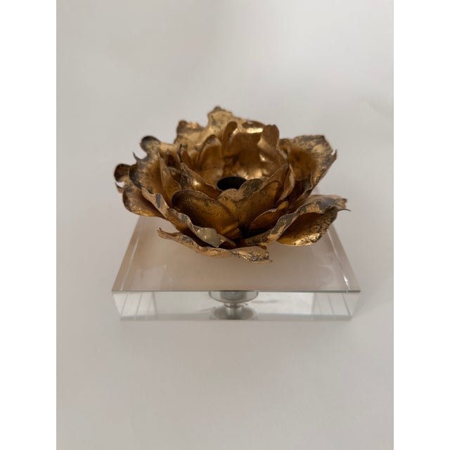 Gold leaf blossom-like candlestick holder with lucite base for a single tapered candle. Candle can be inserted into the...
