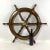 Varnish wood ships wheel with substantial brass hub and brass trim ring around hub and brass trim around the...