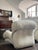 Very stylish armchairs with steel frame and curvy shapes. Reupholstered in off white boucle fabric. There is an option to...