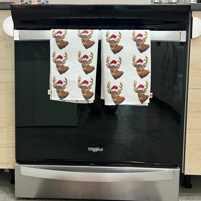 What the buck? A reindeer in a Santa hat, that's what! Original design is based on needlepoint art created by Cheryl...