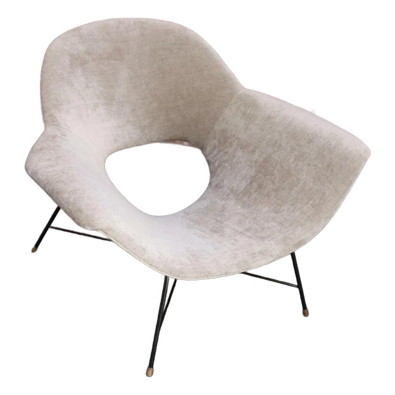 Modern chair with white velvet upholstery and black metal legs