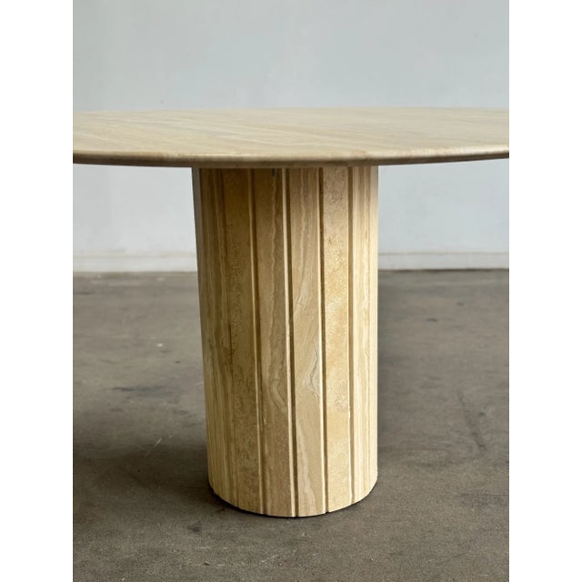 W51.5 D51.5 H28.5 Fully restored travertine dining table in excellent condition. Unit features a pedestal base, a smooth...