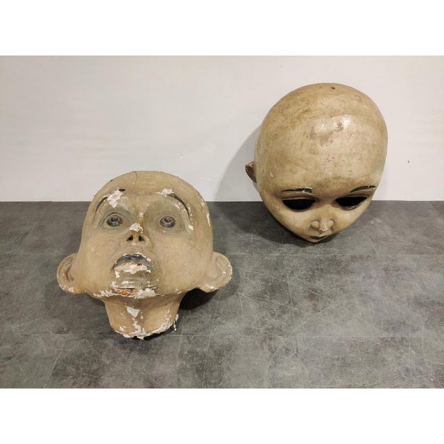 Rare, large early 20th century carnival masks made from wood and painted papier maché. Although looking a little creepy...