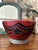 Stunning antique turned and carved wood opium or prayer bowl. Vibrant red paint decoration on a black field. This piece...