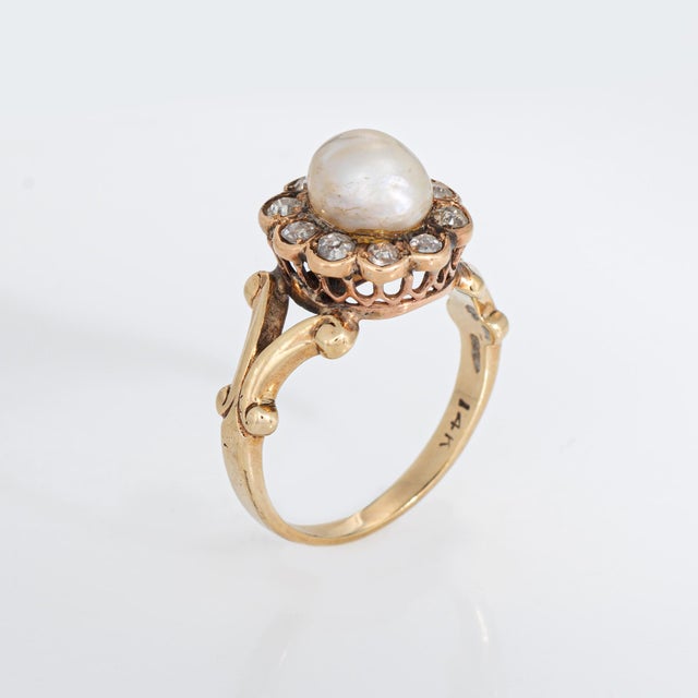 Distinct antique Victorian natural saltwater pearl & diamond ring (circa 1880s to 1900s) crafted in 14 karat yellow gold....