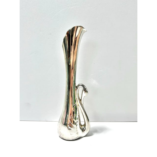 A wonderful silverplated vase featuring a graceful swan made in the Art Deco style. A perfect piece to tuck on a side...