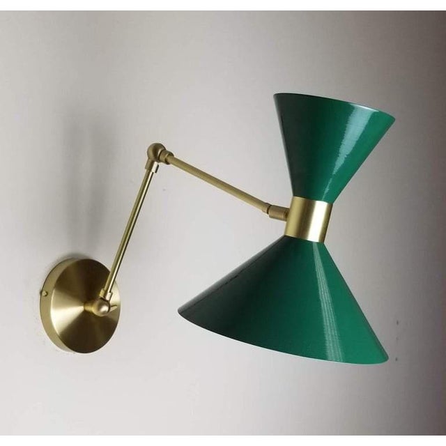 Monarch large scale wall-mount reading lamp or sconce with articulated arms shown in natural brass and our luxe dark green...