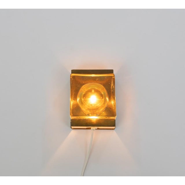 Gold coloured Maritim Lampet wall lamp, produced by Danish lighting manufacturer Vitrika in the 1970s. The lamp consists...