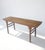 This long, slender console table is crafted from solid elm wood, featuring a rectangular top with a visible natural grain....