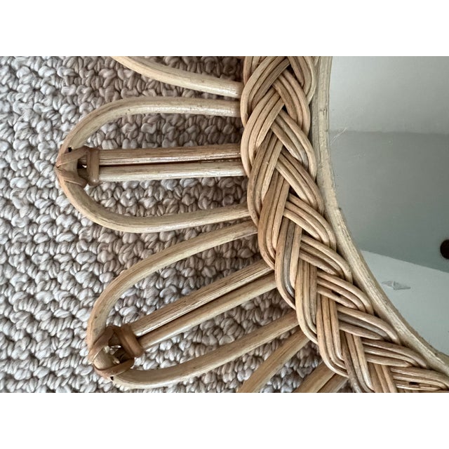 Lovely Rattan wicker sunburst mirror with braided rattan.