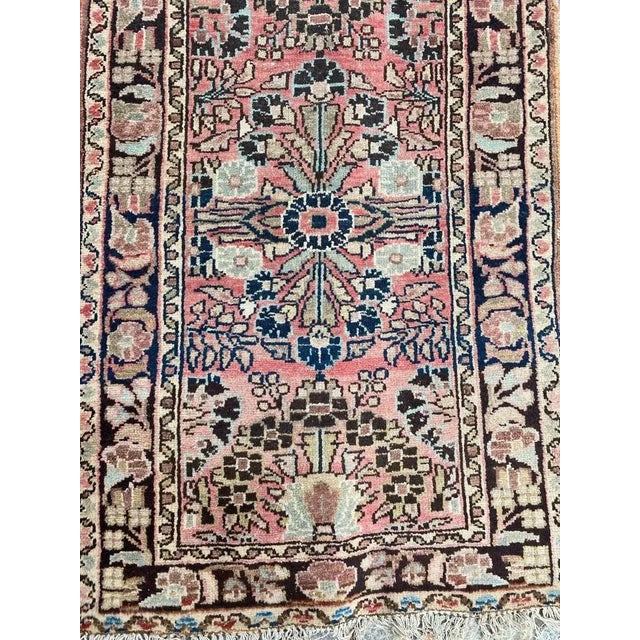 Beautiful early 20th century Hamadan runner with beautiful floral design and nice colors with a pink field color, entirely...