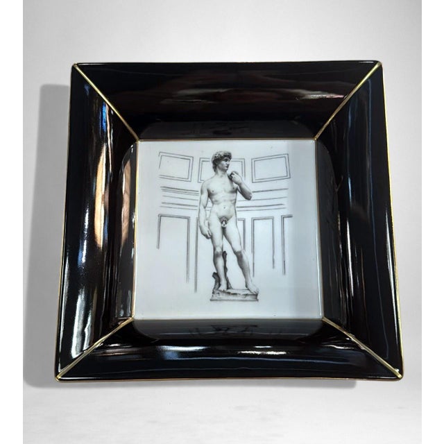 Elegant Italian valet tray and ashtray in white porcelain with a black rim, crafted using a handmade mold that creates its...