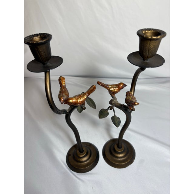 This pair of cast iron candle stick holders wit branch's home table decoration. They hold one regular candle are each used...