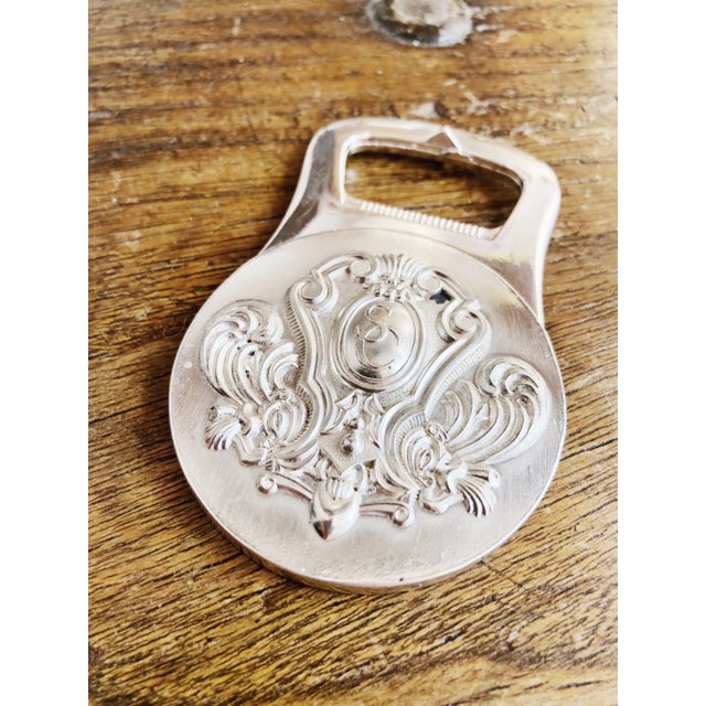 A wonderful vintage heavy silver plated bottle opener made by Christofle for the opening of the Stanford Court Hotel in...