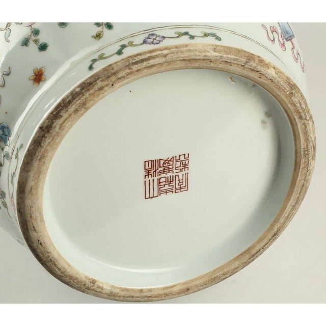 A beautifully rendered early 20th-century Chinese porcelain vase executed in the Qianlong style, featuring finely painted...