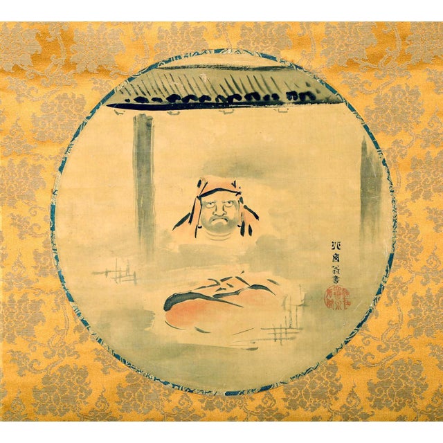 A Japanese hanging scroll attributed to Edo period painter Hanabusa Itcho (1652-1724). The artwork features a silk roundel...