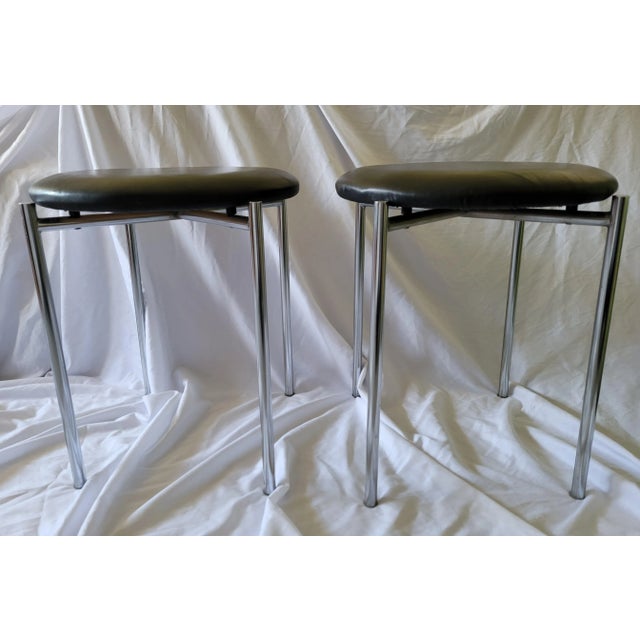 Vintage Bauhaus Low Stacking Stools. Cushioned seating covered with Black vinyl, and tubular steel legs. Streamlined...