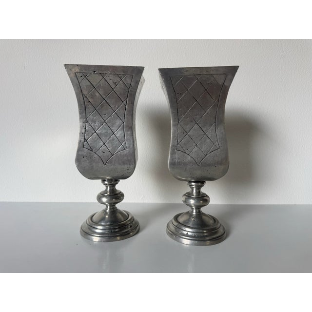 Offered here is a striking pair of vintage pewter vases, crafted in Spain by Pedraza Segovia. Featuring an elegant flared...