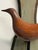 This mid-century wall sculpture features a beautifully stylized bird form, hand-carved from solid wood and mounted on a...