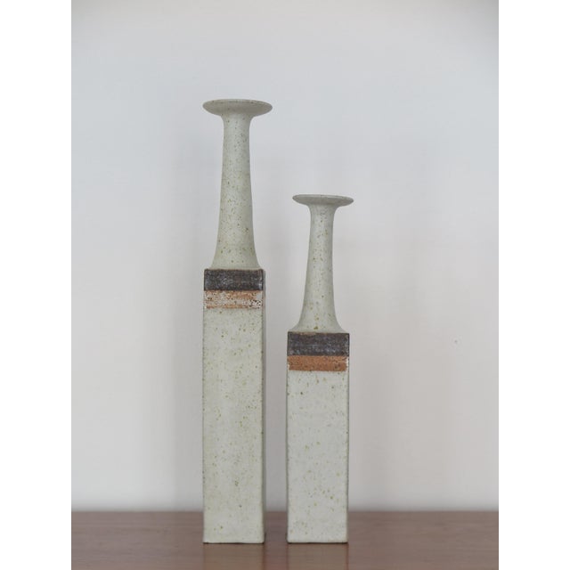 Pair of stoneware bottle vases designed and produced by artist Bruno Gambone, signed "Gambone Italy" under the base. Made...