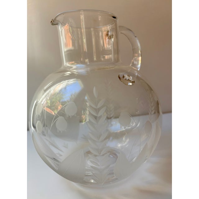 This Tiffany & Co. Lily pitcher features the exquisite Lily of the Valley design. It was crafted in Slovenia in 1999. This...