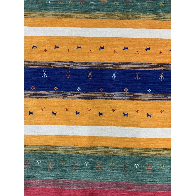 Beautiful Gabbeh Navy Handmade Wool Rug, Country of Origin: India. This exceptional piece draws upon the nomadic Gabbeh...