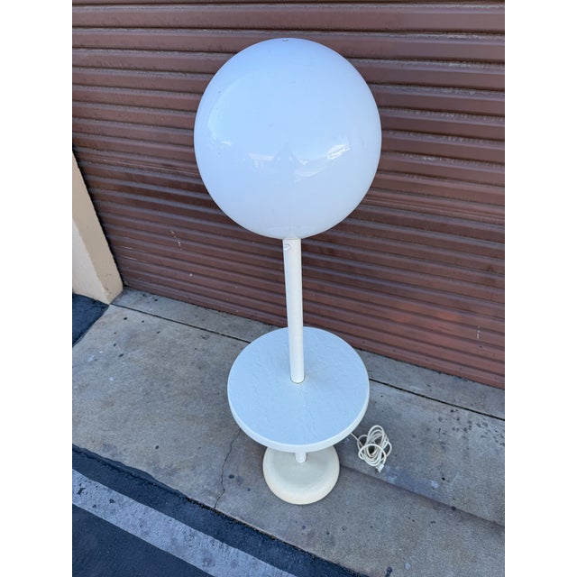 Very cool Italian post modern large globe lamp table. The table part is fiberglass with an embossed design on it. The lamp...