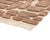 A puzzle of earthen fragments, pieced together by hand. Irregular blocks of mocha mousse in varying shapes and tones...