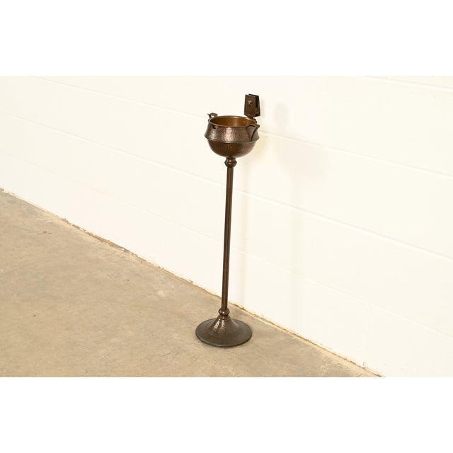A rare and exceptional antique Mission or Arts & Crafts period hammered copper smoker's stand with ashtray and trefoil...