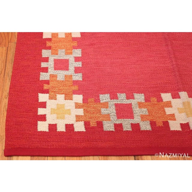 A Simplistic Open Field Design Vintage Red Color Swedish Kilim Rug by Ingegerd Silow, Country of Origin: Scandinavia,...
