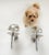Elegant pair of Dutch mid-century wall sconces in polished chrome with mirrored, half-silvered glass globe shades. Each...