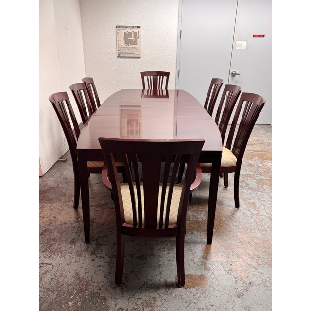 Design Plus Gallery presents a Boat Shaped Cherry Wood Table with Eight Bayonne Chairs from Stickley Furniture. This...