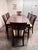 Design Plus Gallery presents a Boat Shaped Cherry Wood Table with Eight Bayonne Chairs from Stickley Furniture. This...