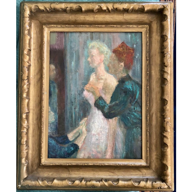 Unsigned oil painting in a dressmakers shop doing a fitting of a gown on her customer. Deep gilt frame surrounds. Perfect...