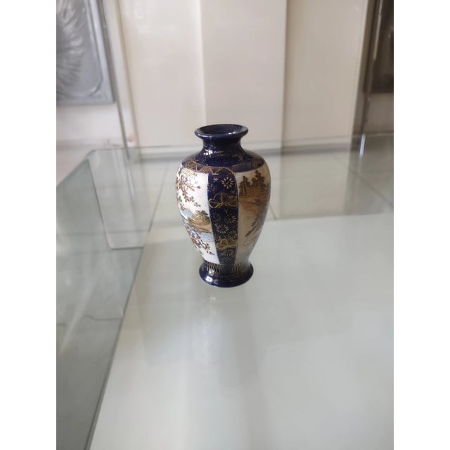 A stunning and rare Japanese Vase featuring a depiction on both sides, on 1 there is a beautiful bird in a flowering tree...