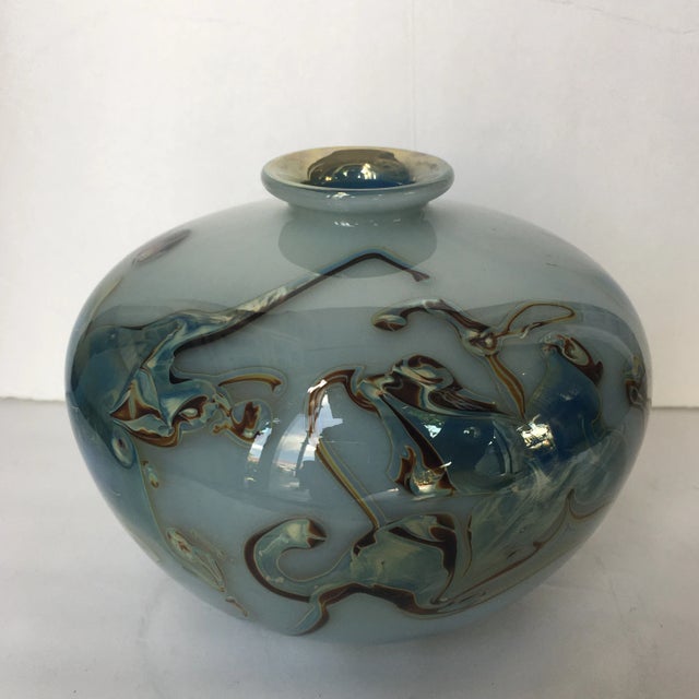 Gorgeous handblown art-glass vase or vessel in a beautiful hue of smokey blue. It has swirls and veining in shades of...