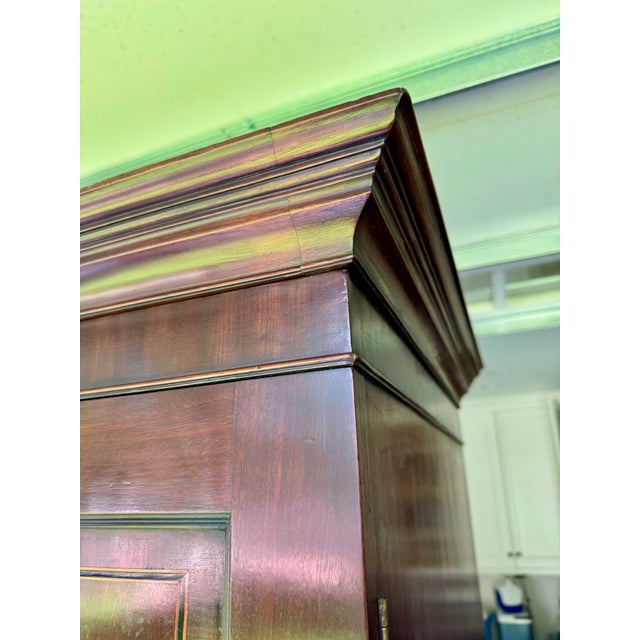Fine English mahogany breakfront linen press wardrobe believed to date from circa 1840 with original handles and keys. The...
