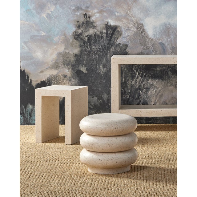 The Carson Ivory Terrazzo Accent Table is made of concrete in an ivory terrazzo finish, the combination making it both...