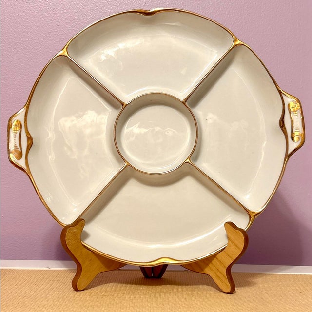 Heinrich & Company gold trimmed, handled appetizer serving platter. The H on the makers mark refers to Heinrich which was...
